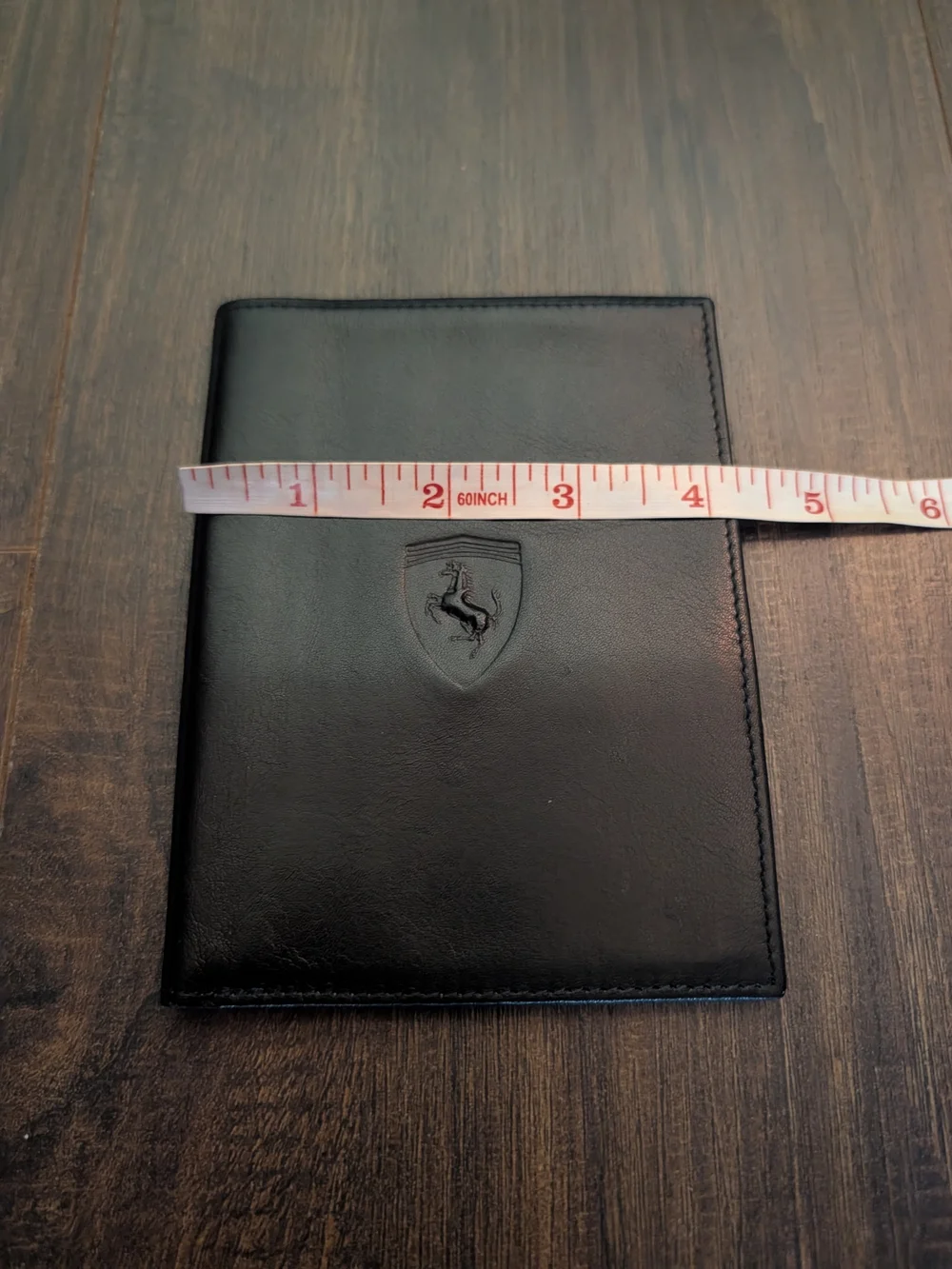 FERRARI Black Leather Passport Wallet with Embossed Shield Logo Red Inside